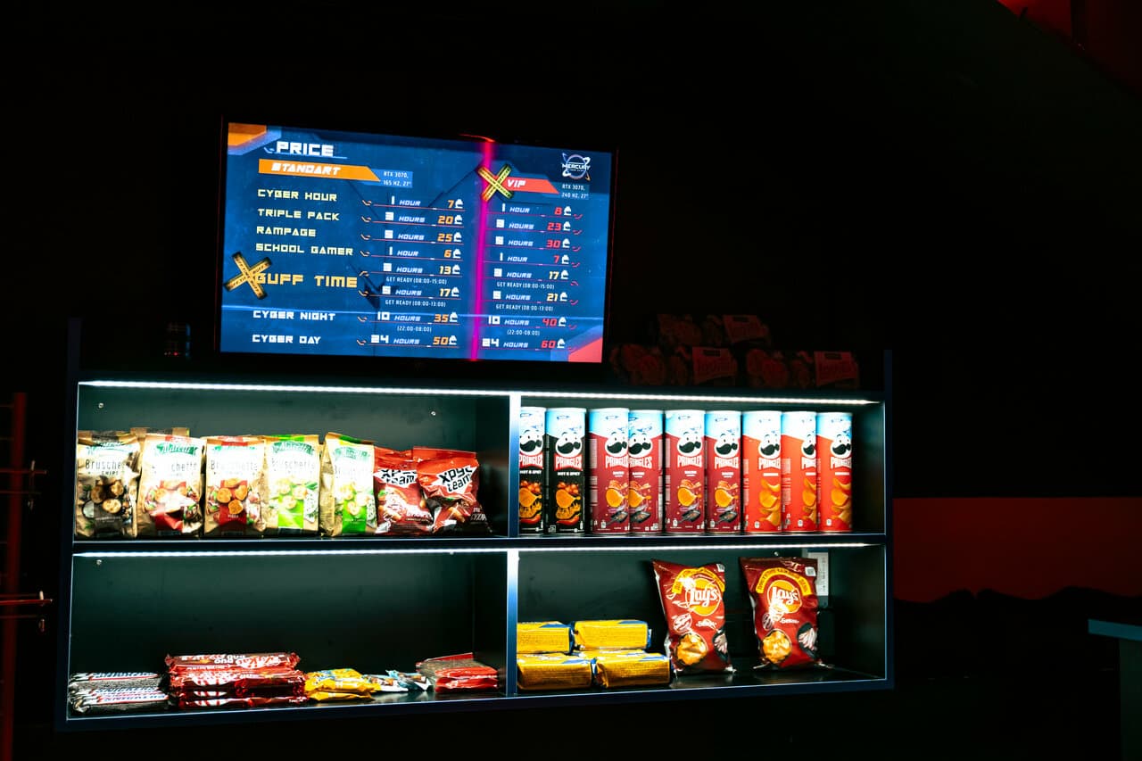 Snack bar and live price board inside Mercury Cyber Club